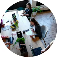Founders collaborating around a long table